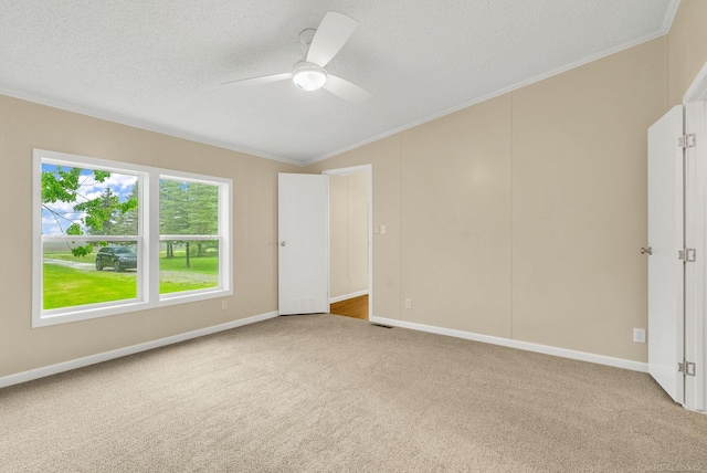 2100 Rowe Rd, Applegate, MI 48401 - unfurnished bedroom featuring carpet flooring, crown molding, a textured ceiling, a ceiling fan, and vaulted ceiling