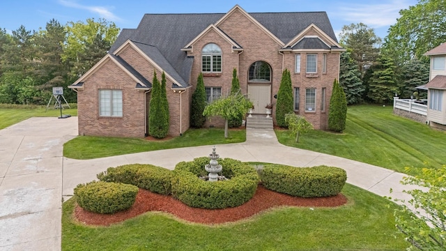 4931 Peggy St, West Bloomfield, MI 48322 - traditional-style home with brick siding and a front lawn