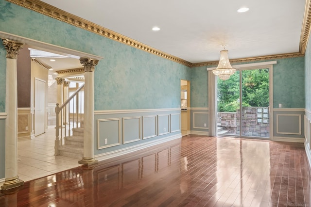 4931 Peggy St, West Bloomfield, MI 48322 - spare room with a decorative wall, a wainscoted wall, crown molding, stairway, and a chandelier