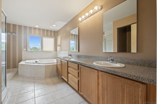 4931 Peggy St, West Bloomfield, MI 48322 - full bathroom featuring double vanity, a bath, a shower stall, and tile patterned floors