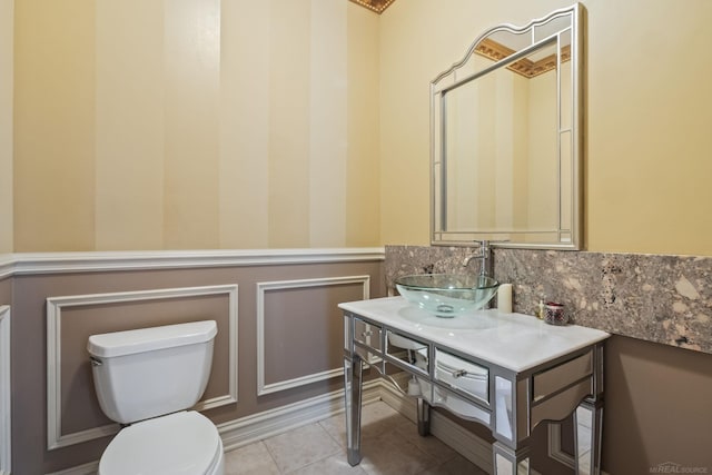 4931 Peggy St, West Bloomfield, MI 48322 - bathroom with toilet, vanity, wainscoting, and tile patterned floors