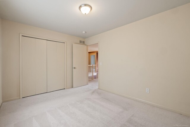 4931 Peggy St, West Bloomfield, MI 48322 - unfurnished bedroom featuring carpet, baseboards, and a closet