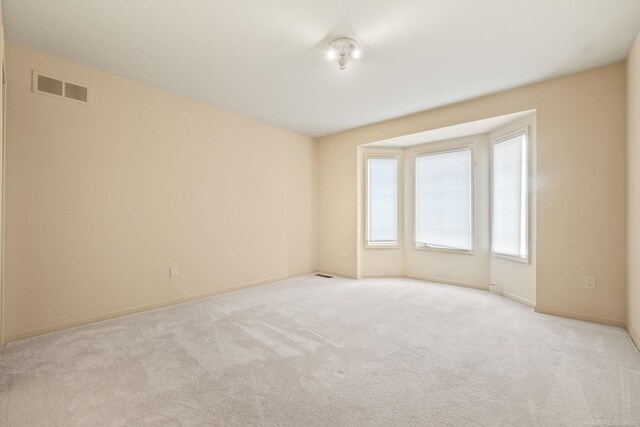 4931 Peggy St, West Bloomfield, MI 48322 - spare room featuring light carpet and baseboards
