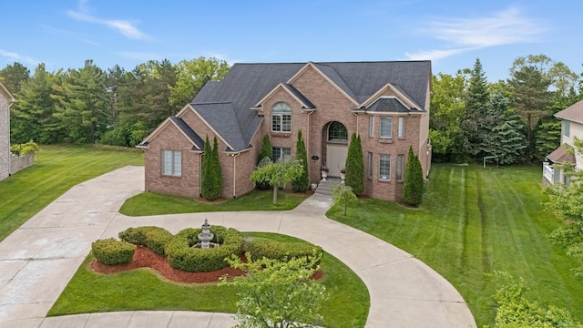 4931 Peggy St, West Bloomfield, MI 48322 - traditional-style house featuring a front lawn and brick siding