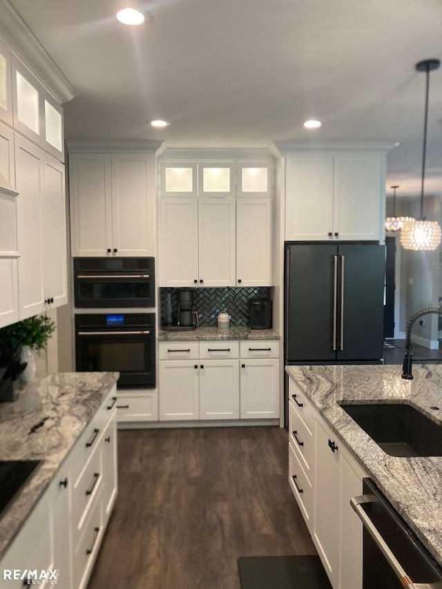 6665 Church Rd, Fair Haven, MI 48023 - kitchen with black appliances, a sink, white cabinetry, and recessed lighting
