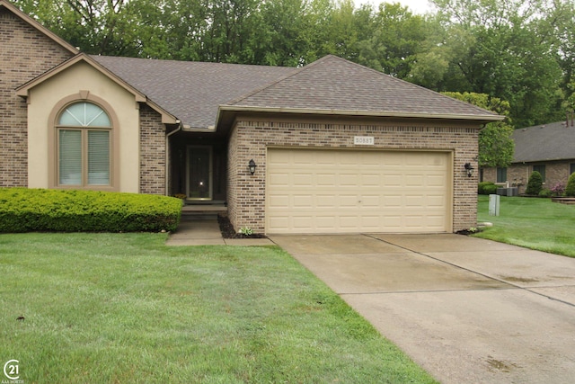 50887 Nature Dr, New Baltimore, MI 48047 - single story home with brick siding, roof with shingles, a garage, and a front lawn