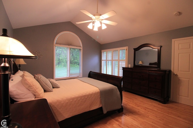 50887 Nature Dr, New Baltimore, MI 48047 - bedroom featuring light wood-type flooring, vaulted ceiling, and a ceiling fan