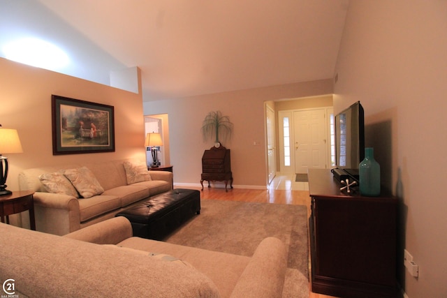 50887 Nature Dr, New Baltimore, MI 48047 - living area featuring light wood finished floors, baseboards, and vaulted ceiling