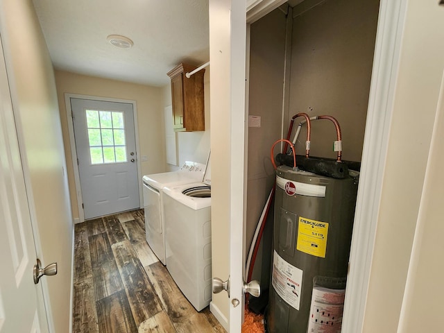 2521 Bonnie Mae Rd, Harrison, MI 48625 - washroom featuring electric water heater, cabinet space, washing machine and dryer, and dark wood-style floors