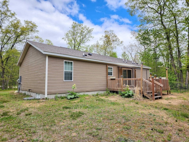 2521 Bonnie Mae Rd, Harrison, MI 48625 - back of property with a wooden deck