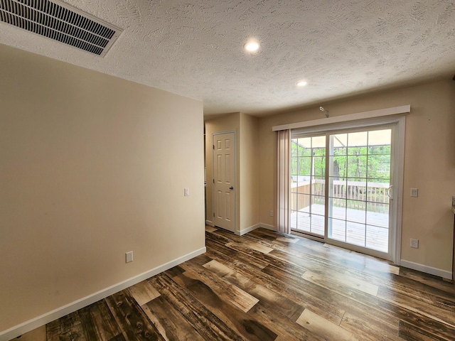 2521 Bonnie Mae Rd, Harrison, MI 48625 - unfurnished room with baseboards, dark wood-style floors, a textured ceiling, and recessed lighting