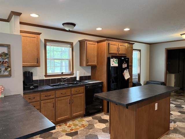 245 Silver Creek Rd, Marquette, MI 49855 - kitchen featuring black appliances, a sink, dark countertops, brown cabinetry, and crown molding