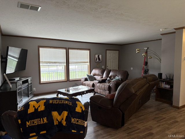 245 Silver Creek Rd, Marquette, MI 49855 - living area featuring crown molding, wood finished floors, a textured ceiling, and baseboards