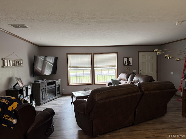 245 Silver Creek Rd, Marquette, MI 49855 - living room featuring a textured ceiling, wood finished floors, and ornamental molding
