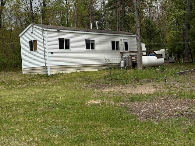 1220 Peasley Blvd, Harrison, MI 48625 - back of property with view of scattered trees and a yard
