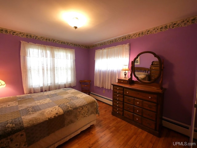 50 Baltic Ave, South Range, MI 49963 - bedroom featuring a baseboard radiator and wood-type flooring