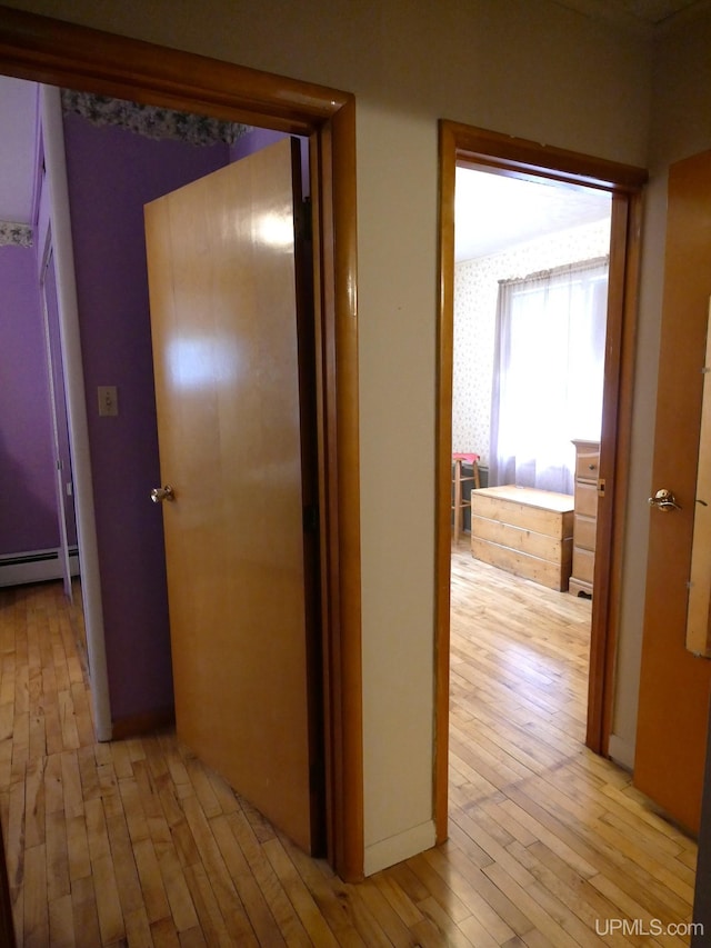 50 Baltic Ave, South Range, MI 49963 - hall featuring light wood-type flooring and a baseboard heating unit