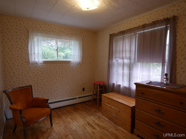 50 Baltic Ave, South Range, MI 49963 - living area featuring a baseboard heating unit, hardwood / wood-style flooring, and wallpapered walls