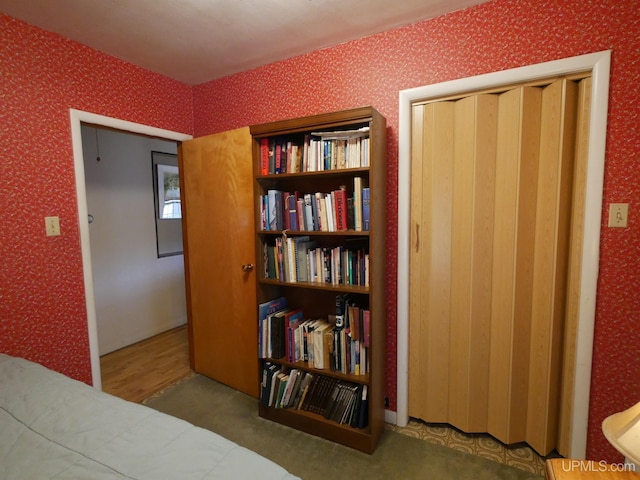 50 Baltic Ave, South Range, MI 49963 - bedroom featuring wallpapered walls and wood finished floors
