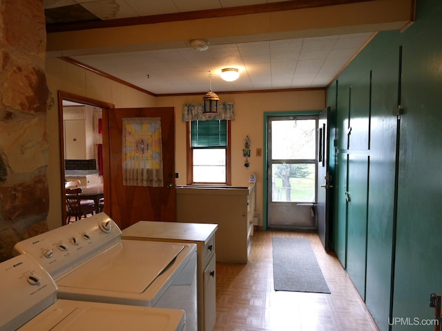 50 Baltic Ave, South Range, MI 49963 - laundry room with washing machine and dryer, crown molding, and light flooring