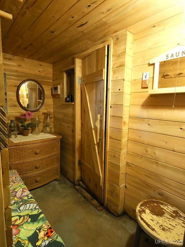 50 Baltic Ave, South Range, MI 49963 - bedroom featuring wooden walls, unfinished concrete floors, and wood ceiling