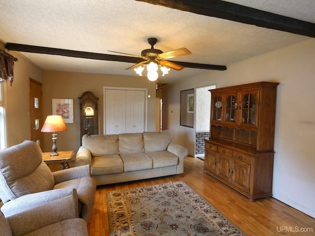 50 Baltic Ave, South Range, MI 49963 - living area featuring ceiling fan, light wood-type flooring, beamed ceiling, and baseboards