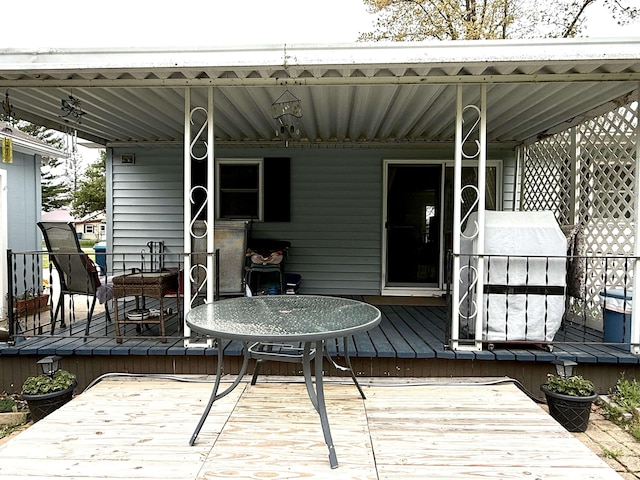 2684 Lakeshore Dr, Gladwin, MI 48624 - wooden terrace featuring outdoor dining area