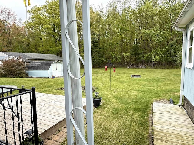 2684 Lakeshore Dr, Gladwin, MI 48624 - view of grassy yard with a deck
