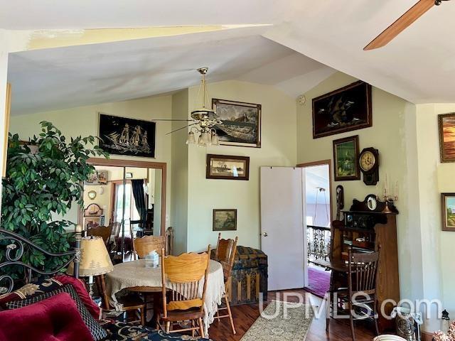 9411 Goodell Rd, Eagle Harbor, MI 49950 - dining room featuring a ceiling fan, lofted ceiling, and wood finished floors