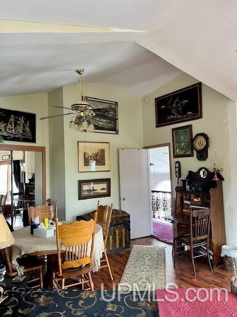9411 Goodell Rd, Eagle Harbor, MI 49950 - dining room with vaulted ceiling, healthy amount of natural light, ceiling fan, and wood finished floors