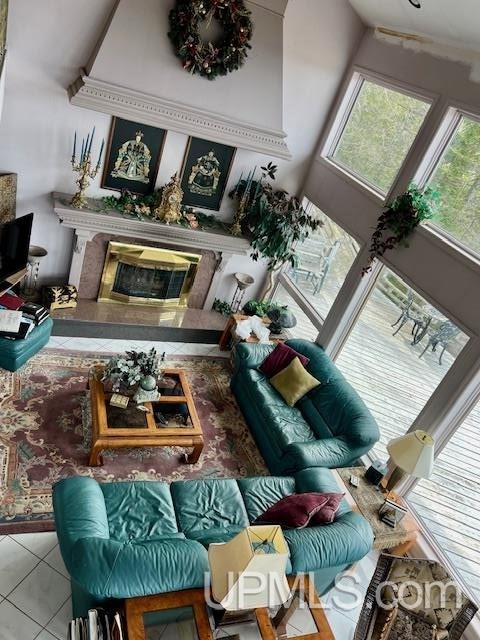 9411 Goodell Rd, Eagle Harbor, MI 49950 - sitting room featuring healthy amount of natural light, a fireplace, and tile patterned floors