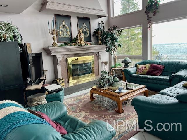 9411 Goodell Rd, Eagle Harbor, MI 49950 - living room featuring a premium fireplace