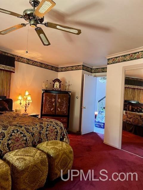 9411 Goodell Rd, Eagle Harbor, MI 49950 - bedroom with carpet and ceiling fan