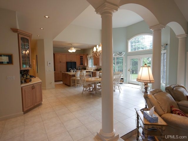 52765 Bootjack Rd, Lake Linden, MI 49945 - living area featuring decorative columns, arched walkways, recessed lighting, ceiling fan, and light tile patterned flooring