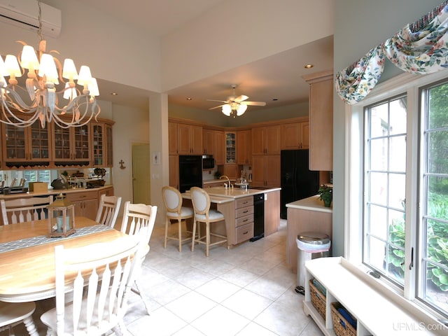 52765 Bootjack Rd, Lake Linden, MI 49945 - dining space with a wall unit AC, light tile patterned flooring, a chandelier, and a ceiling fan