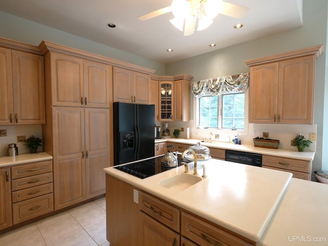 52765 Bootjack Rd, Lake Linden, MI 49945 - kitchen with black appliances, ceiling fan, light countertops, light tile patterned flooring, and tasteful backsplash