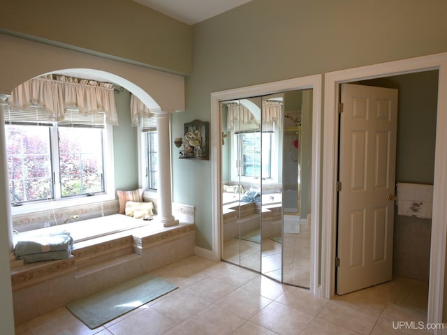 52765 Bootjack Rd, Lake Linden, MI 49945 - full bath with ornate columns, plenty of natural light, and a bath