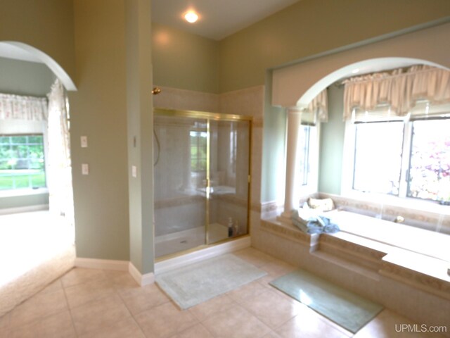52765 Bootjack Rd, Lake Linden, MI 49945 - bathroom with a garden tub, tile patterned flooring, and a shower stall