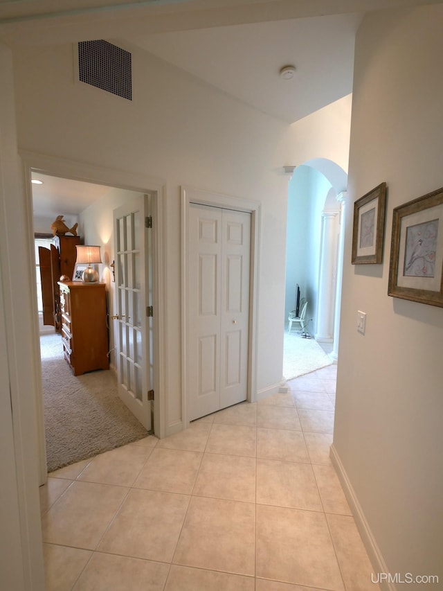 52765 Bootjack Rd, Lake Linden, MI 49945 - hallway with arched walkways, light tile patterned floors, and baseboards