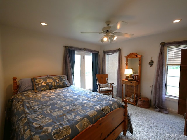 52765 Bootjack Rd, Lake Linden, MI 49945 - carpeted bedroom featuring multiple windows, access to exterior, a ceiling fan, recessed lighting, and baseboards