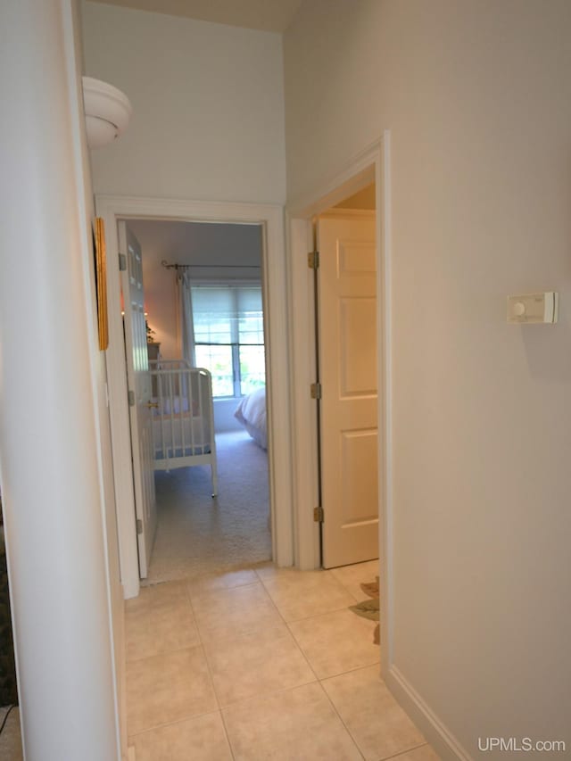 52765 Bootjack Rd, Lake Linden, MI 49945 - corridor with light tile patterned floors, light colored carpet, and baseboards