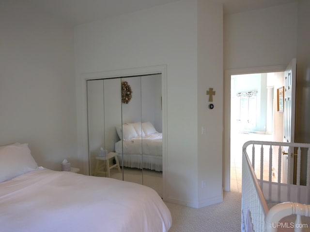 52765 Bootjack Rd, Lake Linden, MI 49945 - bedroom with light colored carpet, a closet, and baseboards