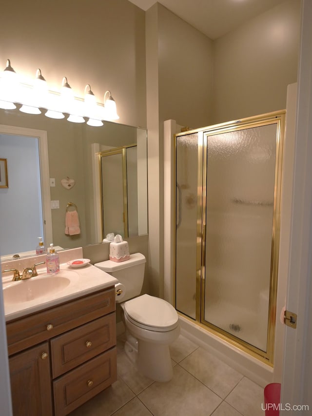 52765 Bootjack Rd, Lake Linden, MI 49945 - full bathroom featuring tile patterned floors, vanity, a stall shower, and toilet