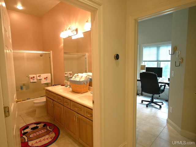 52765 Bootjack Rd, Lake Linden, MI 49945 - bathroom featuring tile patterned floors, double vanity, combined bath / shower with glass door, and toilet
