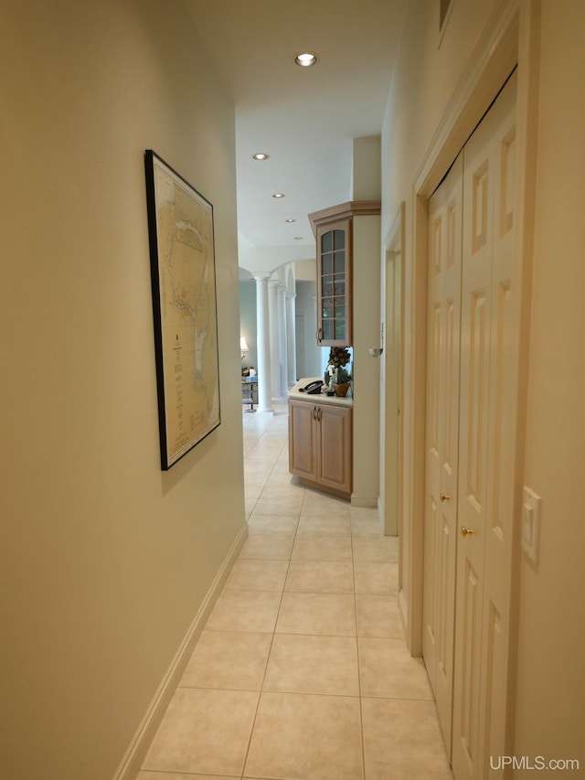 52765 Bootjack Rd, Lake Linden, MI 49945 - corridor featuring decorative columns, light tile patterned flooring, recessed lighting, and baseboards