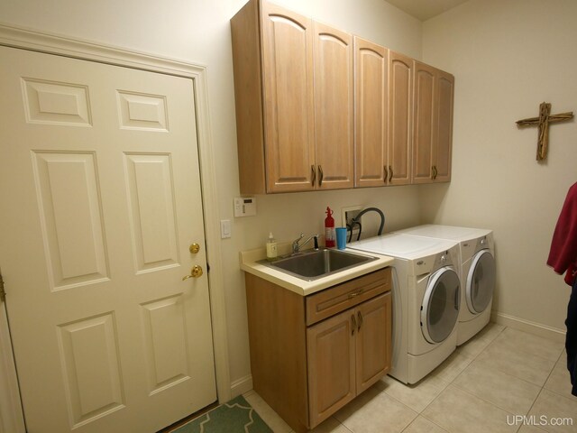 52765 Bootjack Rd, Lake Linden, MI 49945 - washroom with cabinet space, washing machine and dryer, light tile patterned floors, and baseboards