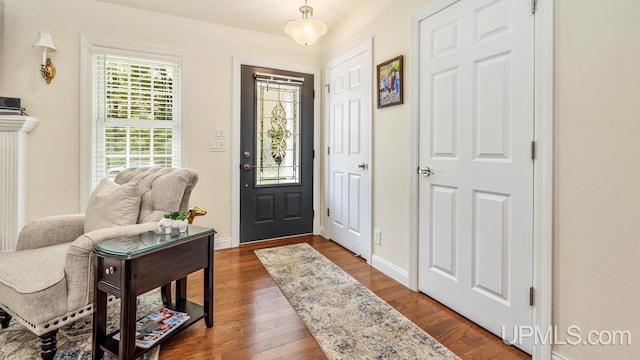 6376 Marie L.45 Ln, Escanaba, MI 49829 - entryway with dark wood finished floors and baseboards