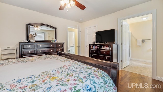 6376 Marie L.45 Ln, Escanaba, MI 49829 - bedroom featuring wood-type flooring, baseboards, and a ceiling fan
