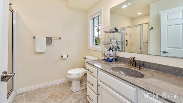 6376 Marie L.45 Ln, Escanaba, MI 49829 - full bathroom with a stall shower, baseboards, vanity, and toilet