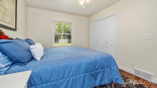 6376 Marie L.45 Ln, Escanaba, MI 49829 - bedroom with wood finished floors, baseboards, and a closet
